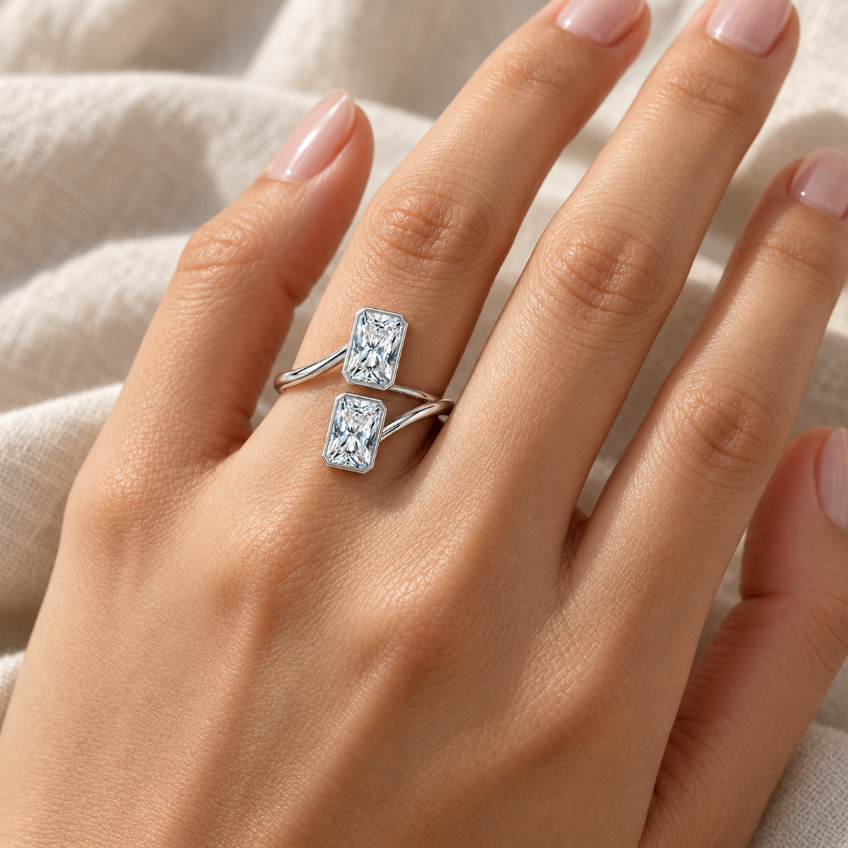 Radiant Bezel Bypass Ring in 14K white gold worn on hand – illustrative rendering, approximate scale