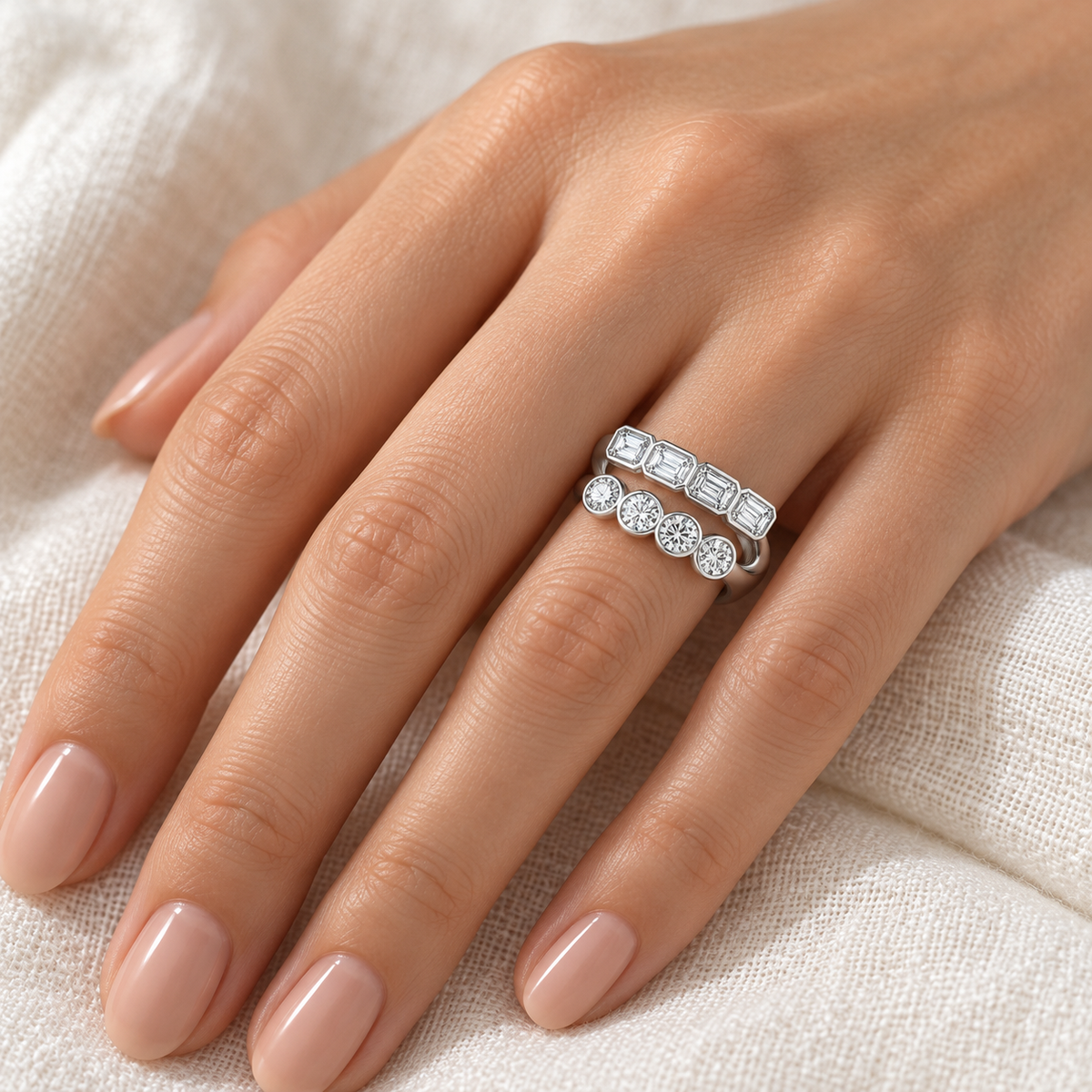 Emerald & Round Double-Row Bezel Ring in 14K white gold, on-hand styling view – illustrative rendering