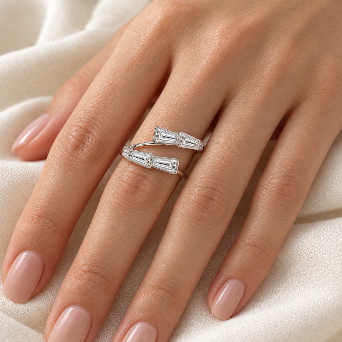 Tapered Baguette Bezel Wrap Ring in 14K white gold, on-hand styling view – illustrative rendering