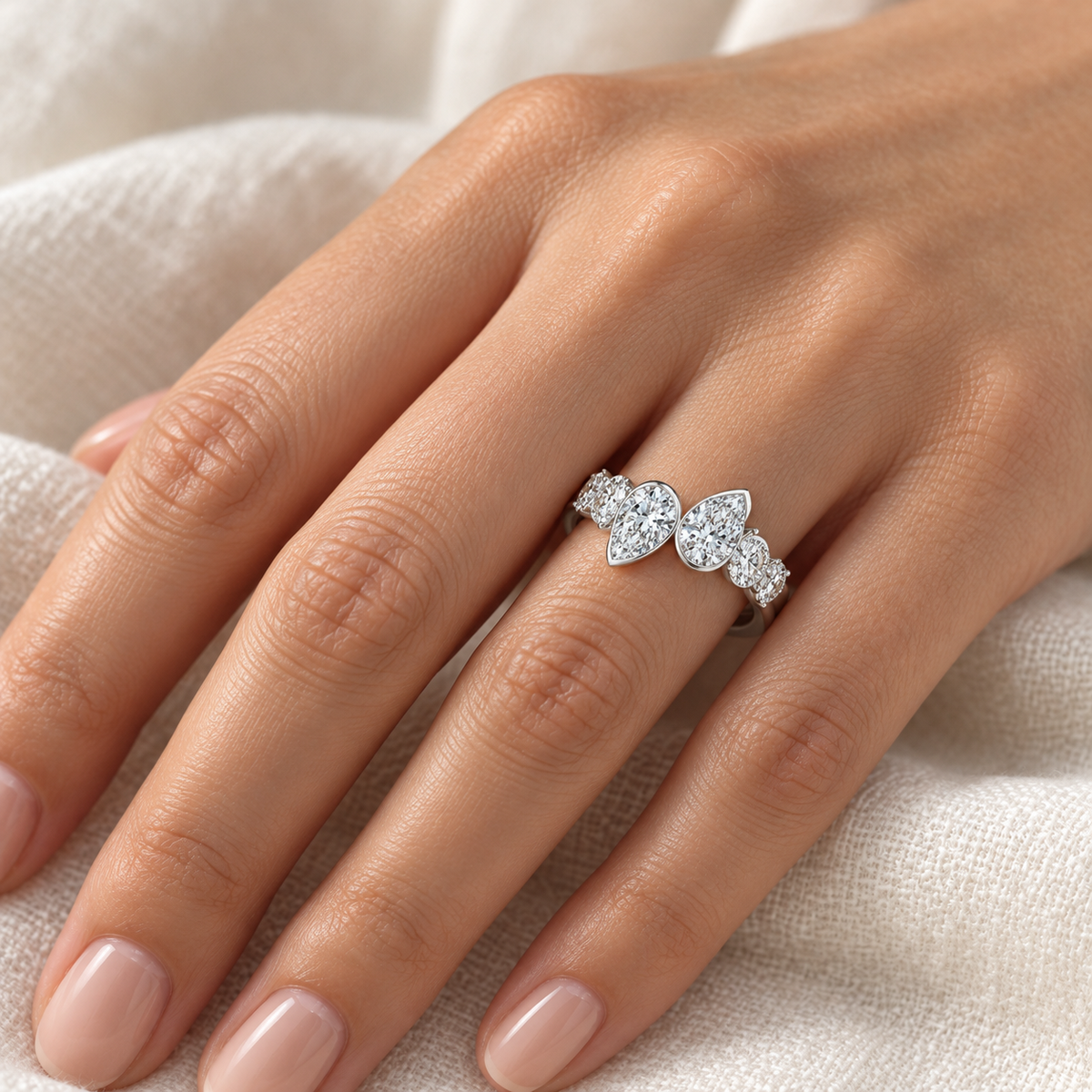 Pear & Round Bezel Duet Ring in 14K white gold, on-hand styling view – illustrative rendering