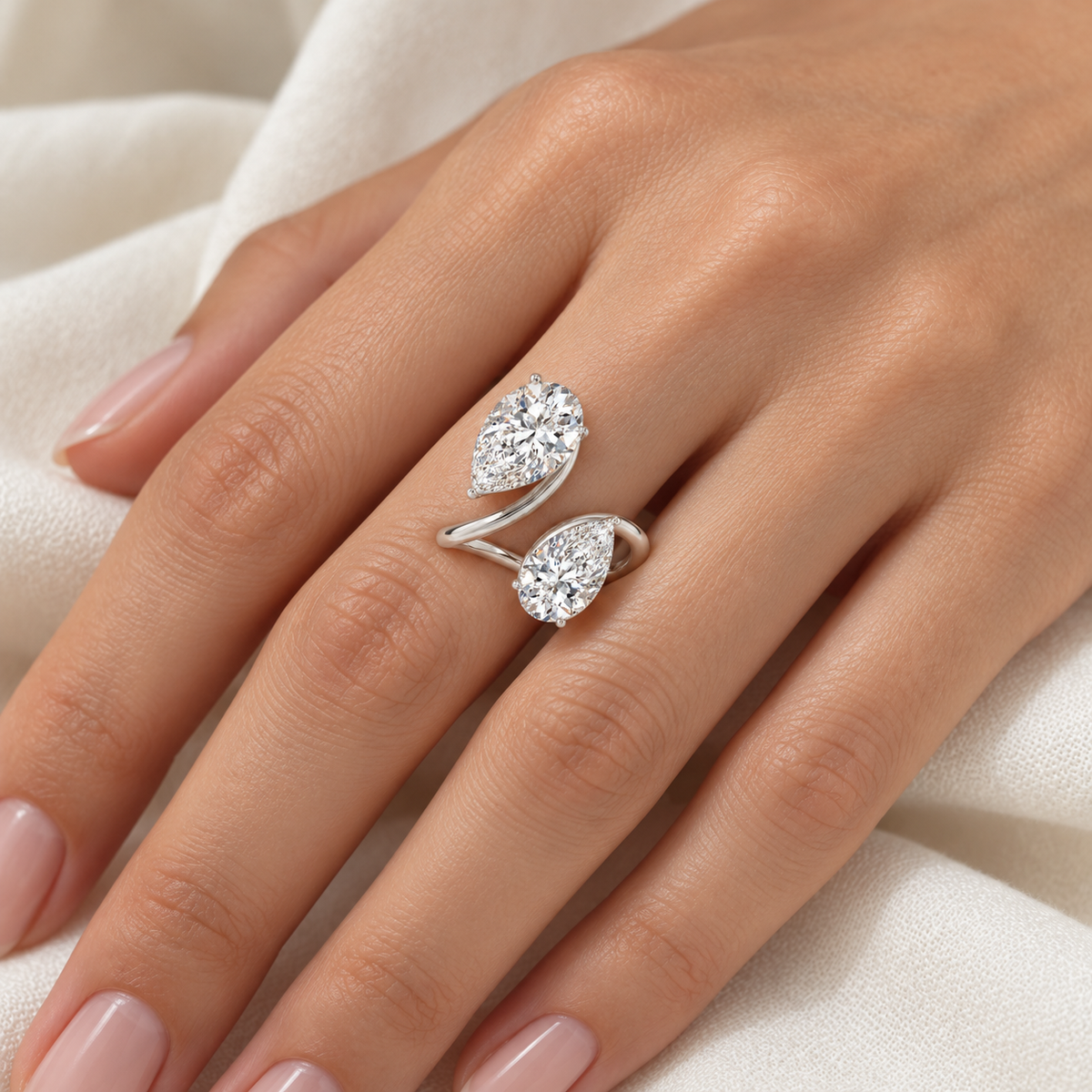 Pear Bezel Open Wrap Ring in 14K white gold, on-hand styling view – illustrative rendering