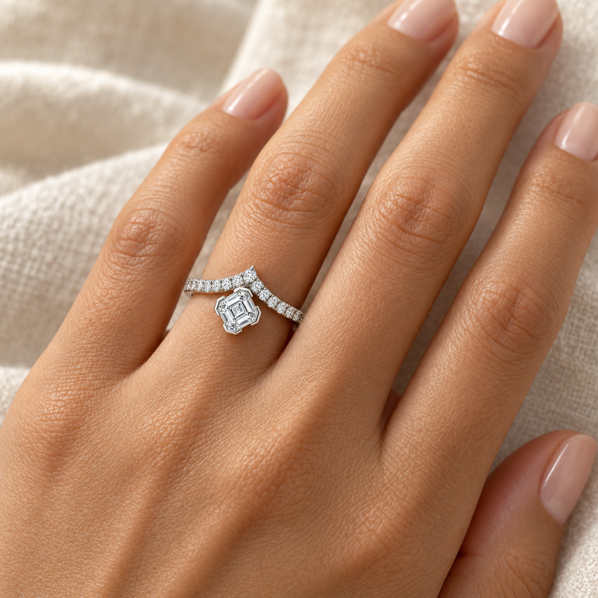 Asscher Bezel Chevron Ring in 14K white gold worn on hand – illustrative rendering, approximate scale