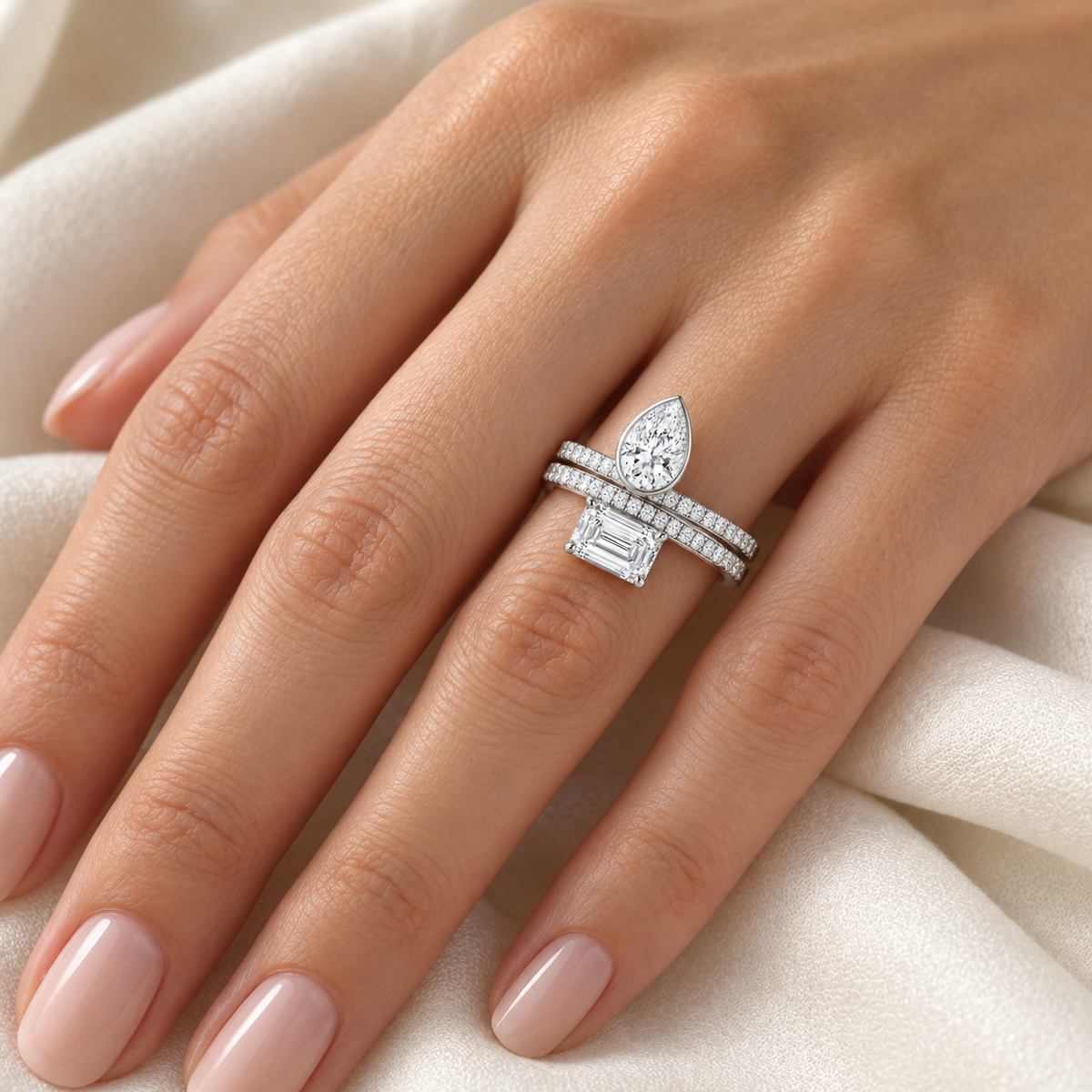 Pear & Emerald Pavé Bypass Ring in 14K white gold, on-hand styling view – illustrative rendering