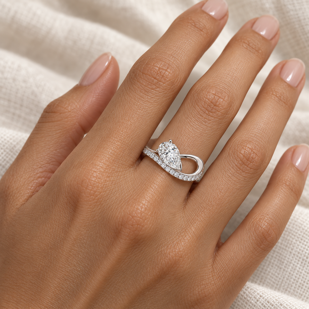 Pear Pavé Loop Ring in 14K white gold worn on hand – illustrative rendering, approximate scale