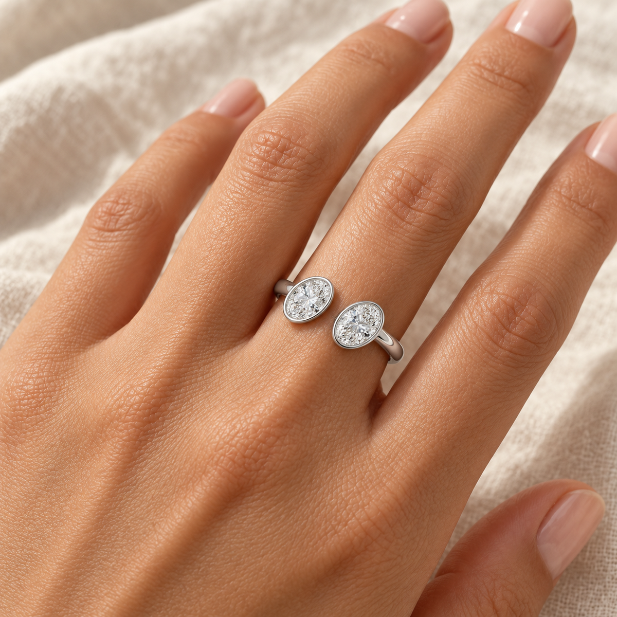 Oval Bezel Open Cuff Ring in 14K white gold worn on hand – illustrative rendering, approximate scale