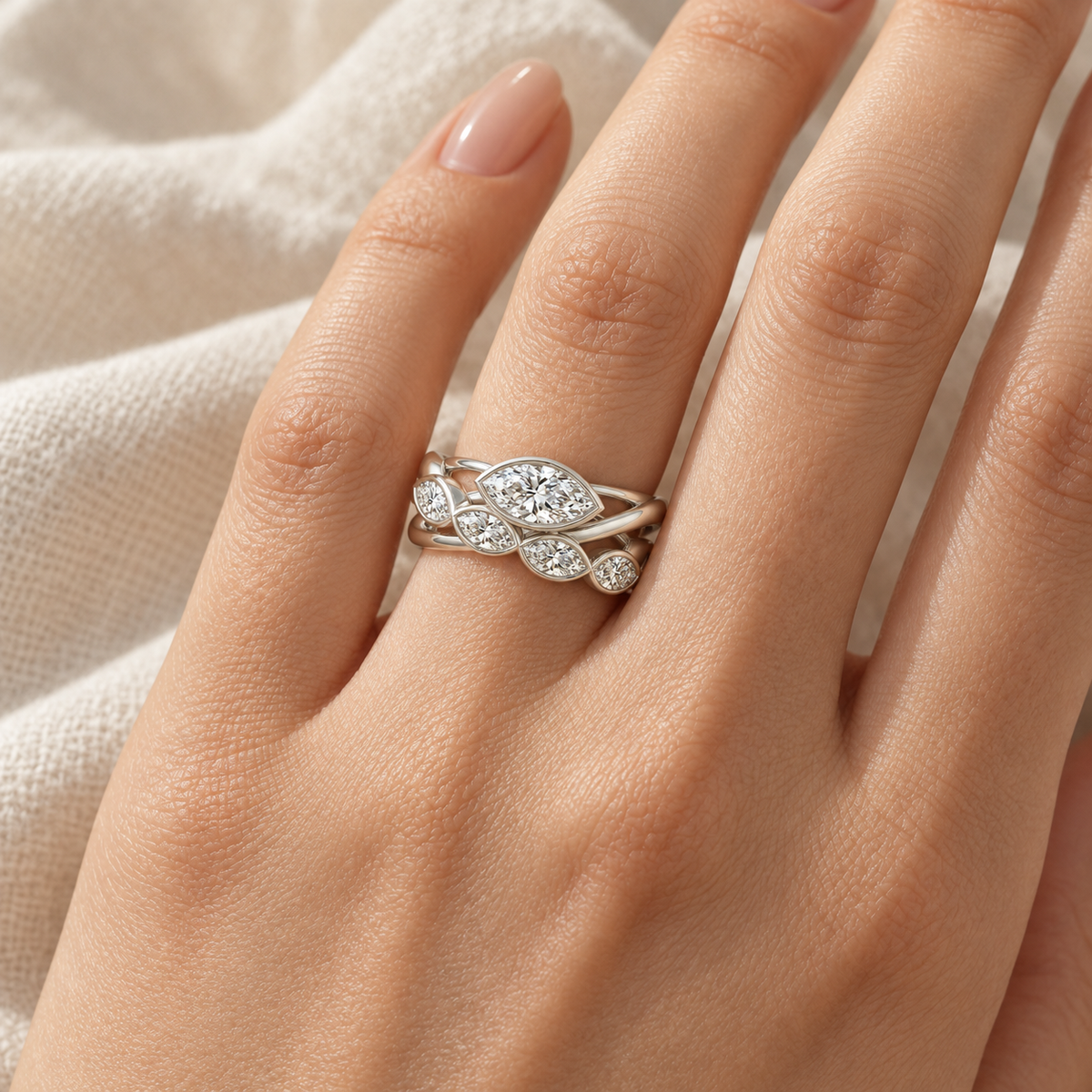 Marquise Bezel Crossover Ring in 14K white gold worn on hand – illustrative rendering, approximate scale