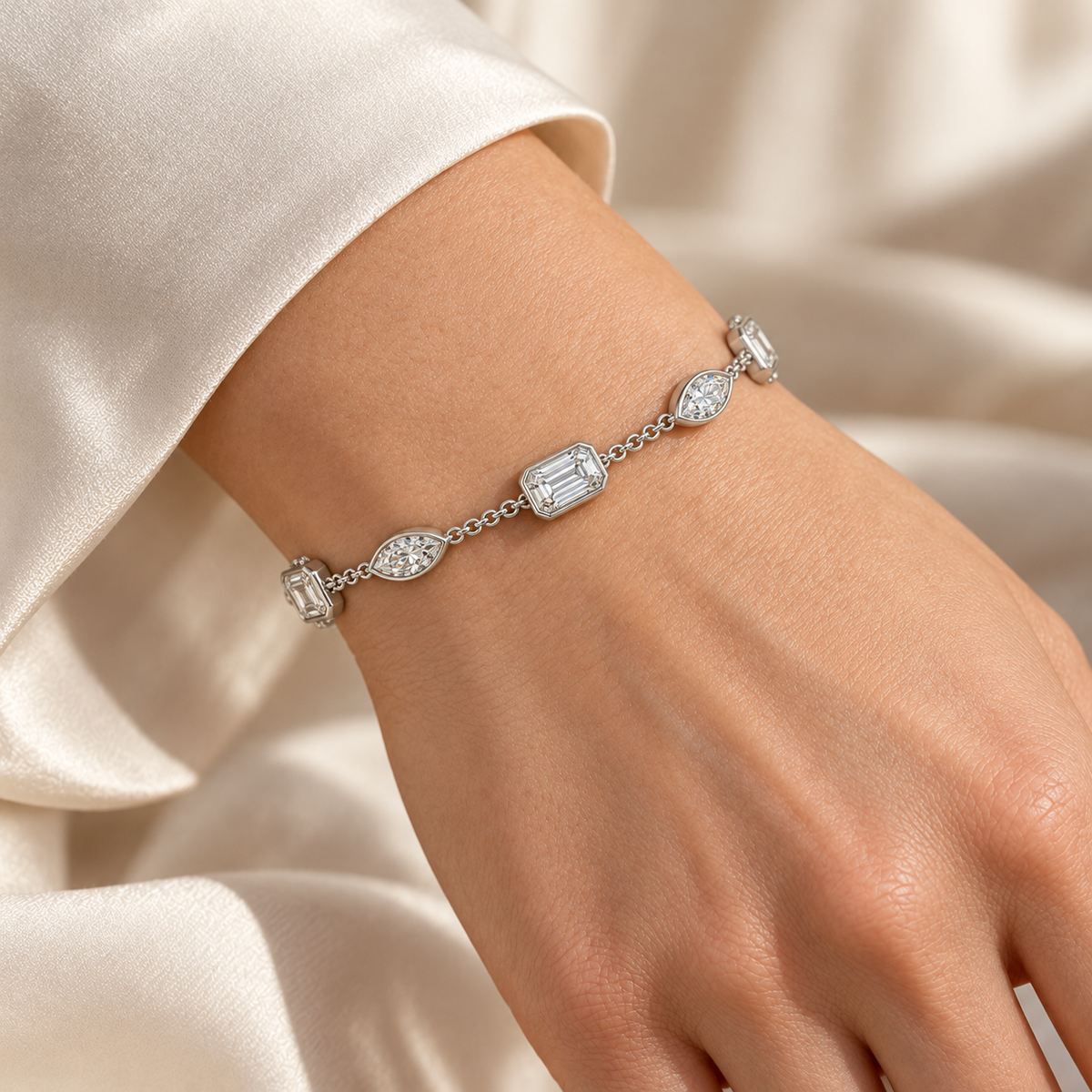 Emerald & Marquise Bezel Station lab-grown diamond bracelet, white gold wrist view — illustrative design rendering