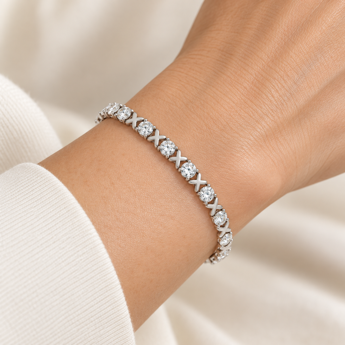 Beveled X Round Tennis lab-grown diamond bracelet in 14K white gold, styled on a wrist — illustrative design rendering