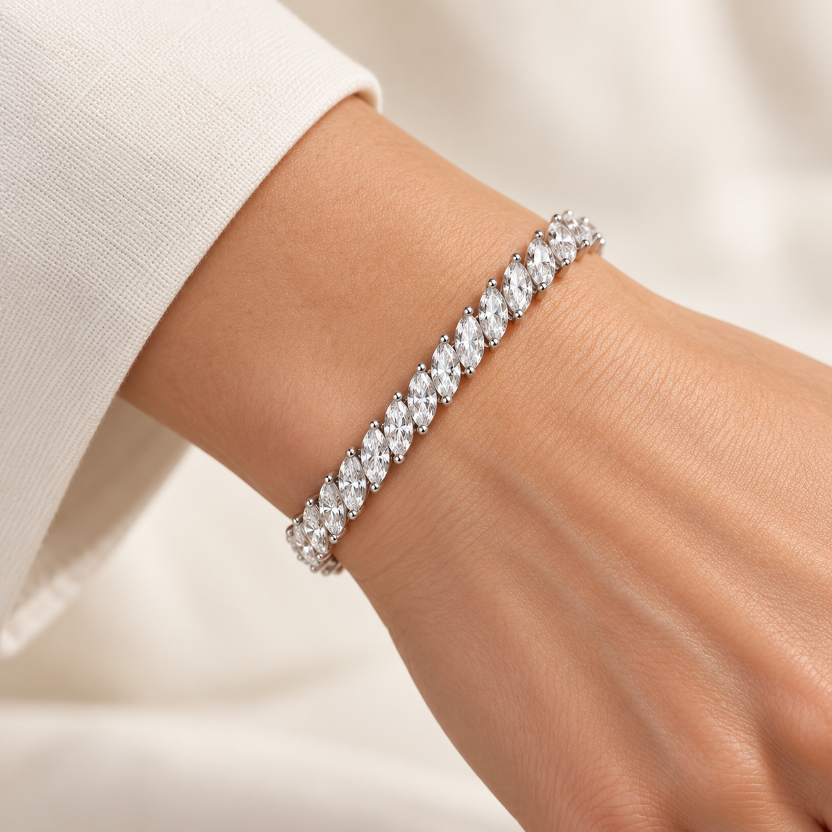 Diagonal Marquise Tennis lab-grown diamond bracelet in 14K white gold, styled on a wrist — illustrative design rendering
