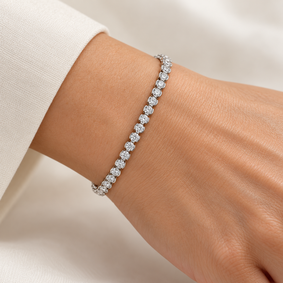Round Half-Bezel Tennis lab-grown diamond bracelet in 14K white gold, styled on a wrist — illustrative design rendering