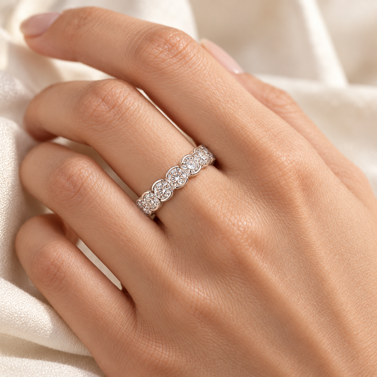 Round Half-Bezel lab-grown diamond eternity ring in 14K white gold, on-hand styling view — illustrative rendering