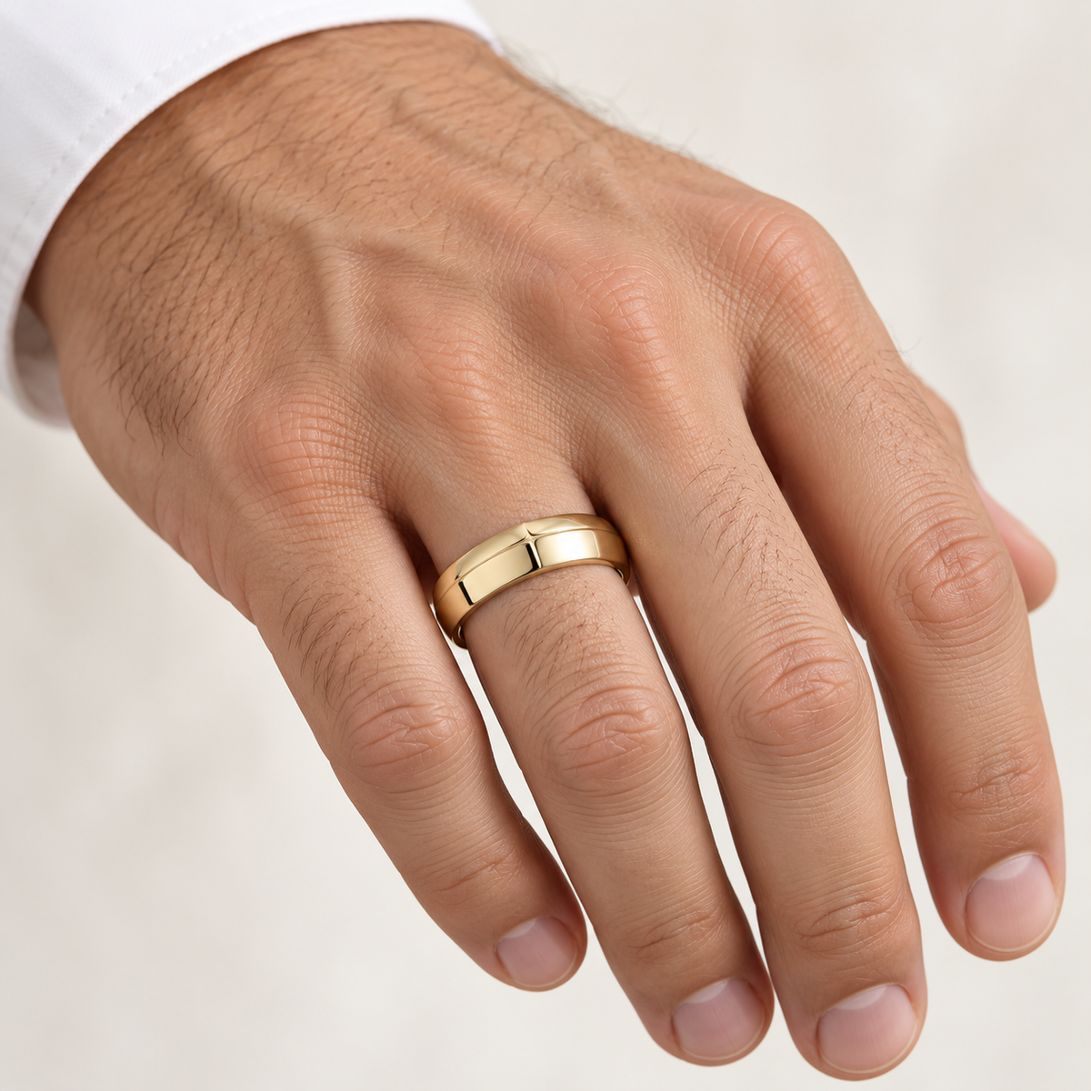 Men’s Apex Knife-Edge 6mm Gold Wedding Band in 14K yellow gold worn on a man's hand — AI-generated illustrative design rendering