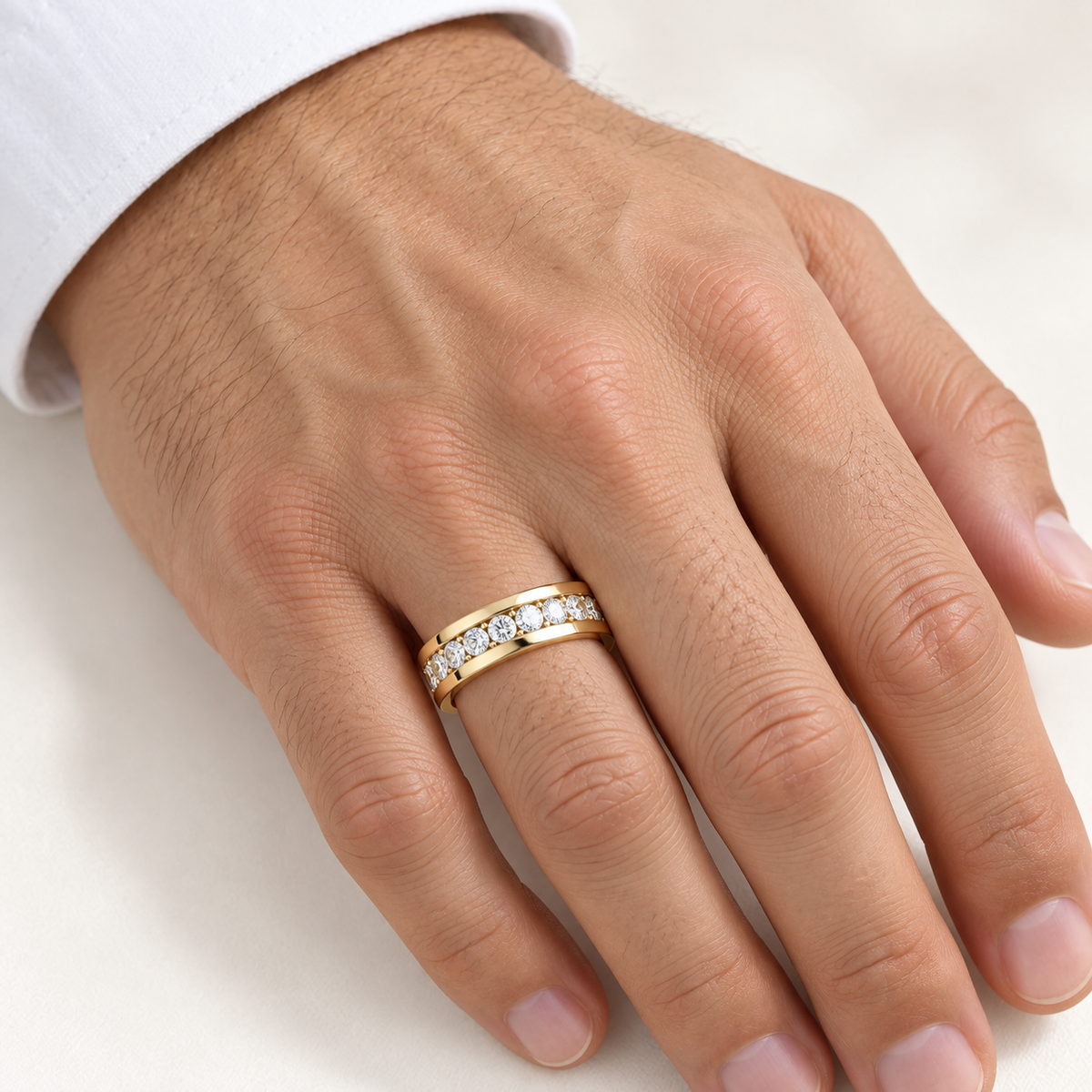 Men’s Horizon Round Channel Lab Diamond Eternity Band — 2 CTW in 14K yellow gold worn on a man's hand — AI-generated illustrative design rendering