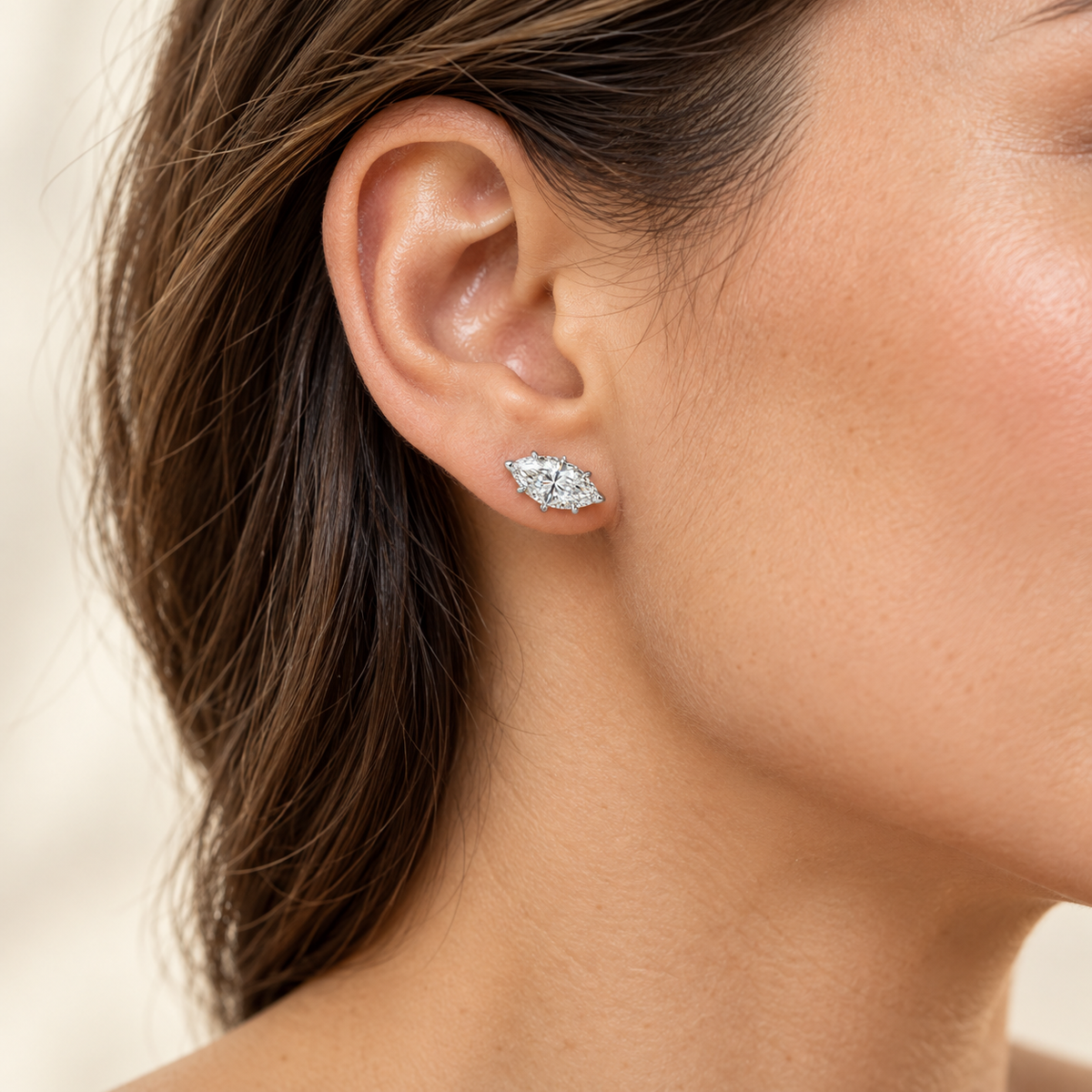 East-West Solitaire lab diamond studs, Marquise, 14K White Gold — worn styling view, approximate scale, illustrative design rendering