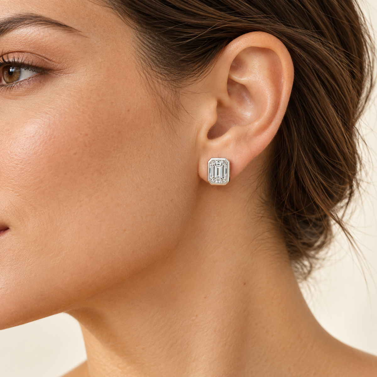 Sculpted Bezel lab diamond studs, Emerald, 14K White Gold — worn styling view, approximate scale, illustrative design rendering