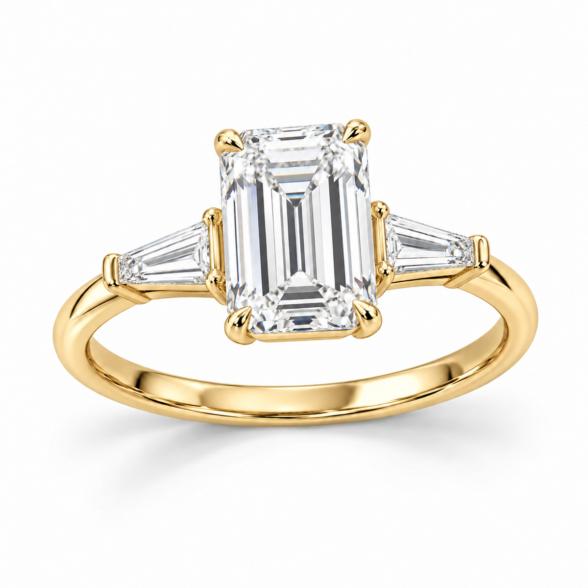 Emerald tapered baguette engagement ring in 14K yellow gold — illustrative render
