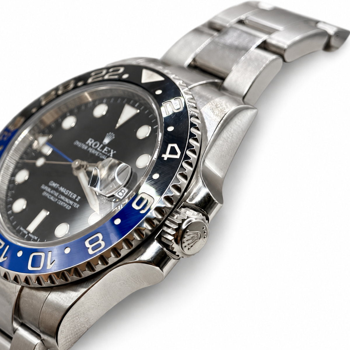 Rolex GMT-Master II 116710BLNR crown-side detail — white background